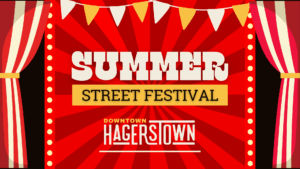 Bold text reads “Summer Street Festival” with “Downtown Hagerstown” below. The background is red with radiating stripes, yellow bunting, and a border of lights and theater-style curtains.