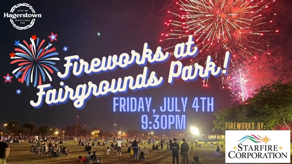 A crowd gathers at night in a park to watch colorful fireworks in the sky. Text reads: "Fireworks at Fairgrounds Park! Friday, July 4th, 9:30 PM. Fireworks by Starfire Corporation." City of Hagerstown logo at top left.