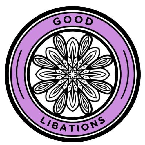 A circular logo with a black and white mandala design in the center, surrounded by a lavender ring. The words 