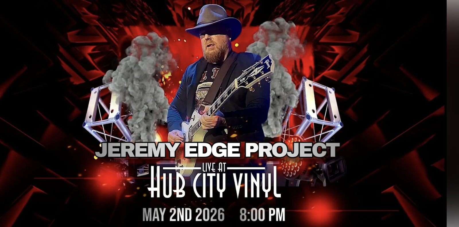 A bearded musician in a hat plays electric guitar on stage with dramatic red and black lighting, smoke, and stage lights. Text reads: "Jeremy Edge Project Live at Hub City Vinyl, May 2nd 2026, 8:00 PM.