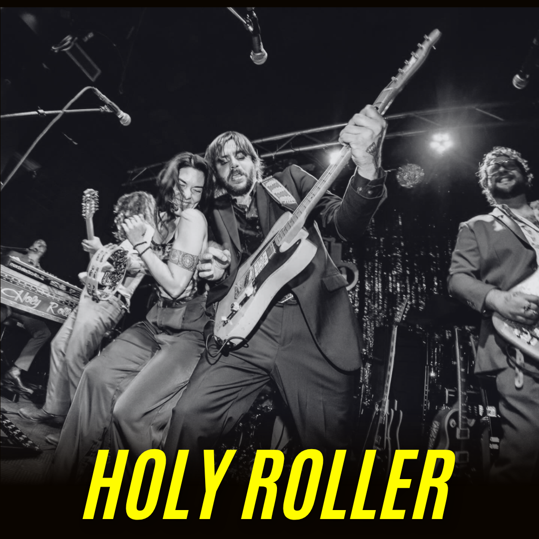 A black-and-white photo of a lively band performing on stage; guitarist and female singer are at the front, surrounded by other musicians. Bold yellow text at the bottom reads "HOLY ROLLER.