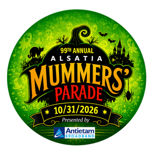 Green circular logo for the 99th Annual Alsatia Mummers’ Parade on 10/31/2026, celebrating Halloween in Hagerstown and featuring festive icons. “Presented by Antietam Broadband” appears at the bottom.